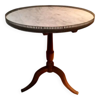 Gueridon circulaire dessu marbre blanc