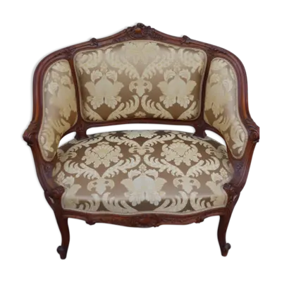 Fauteuil bergère louis XV en Noyer sculpté