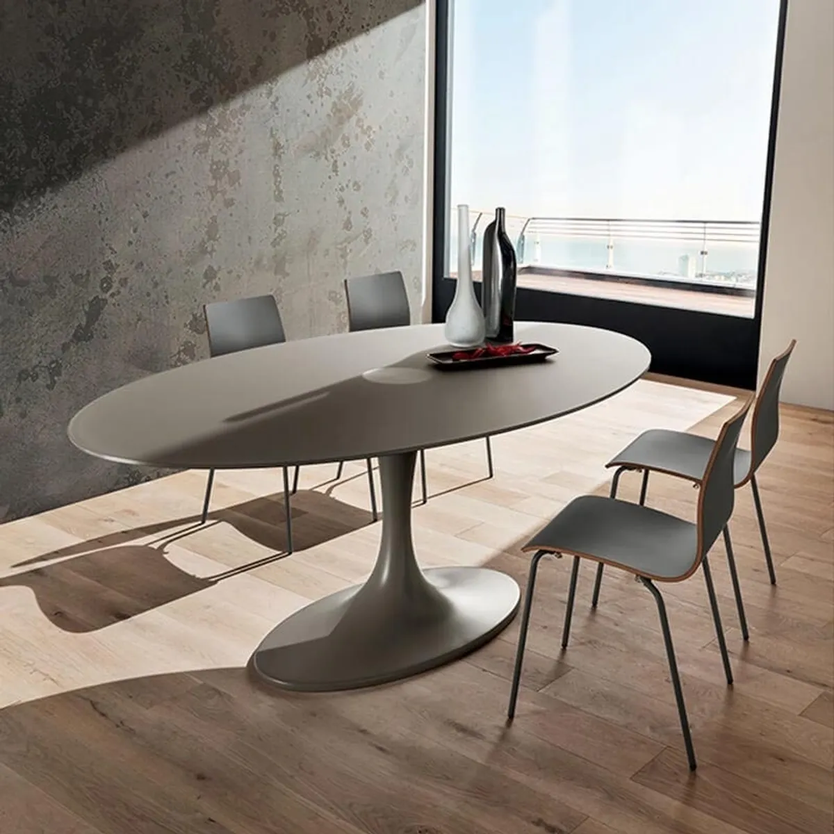 Ruud - Table design ovale en verre pied tulipe